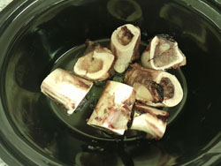 beef bone broth recipe - roasted marrow bones in pot